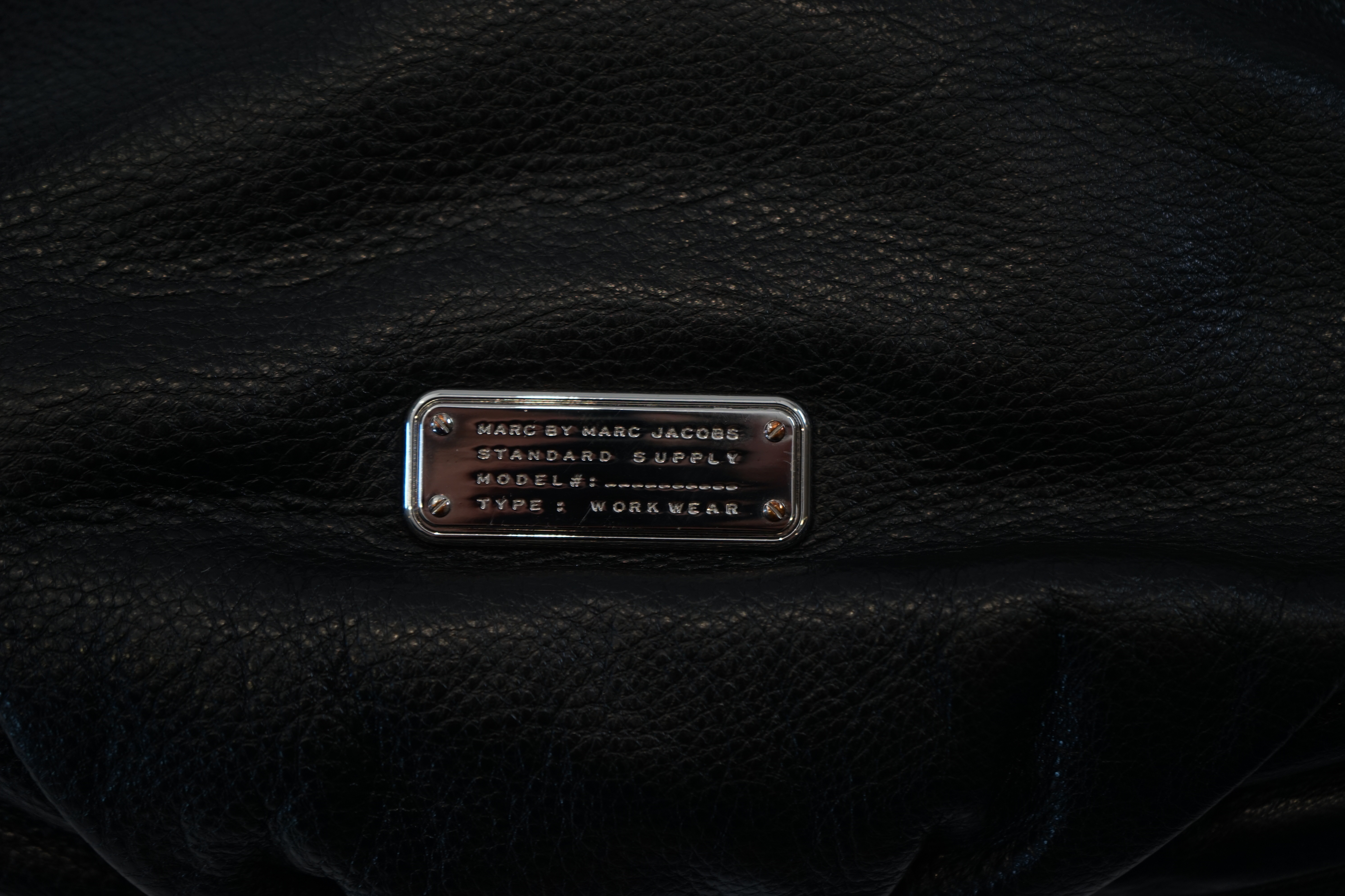 A Marc Jacobs black leather boho with silver zip detail, width 40cm, depth 15cm, height 35cm